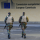 Belgian soldiers patrol outside the European Commission headquarters as police searched the area during a continued high level of security following the recent deadly Paris attacks, in Brussels, Belgium, November 23, 2015.